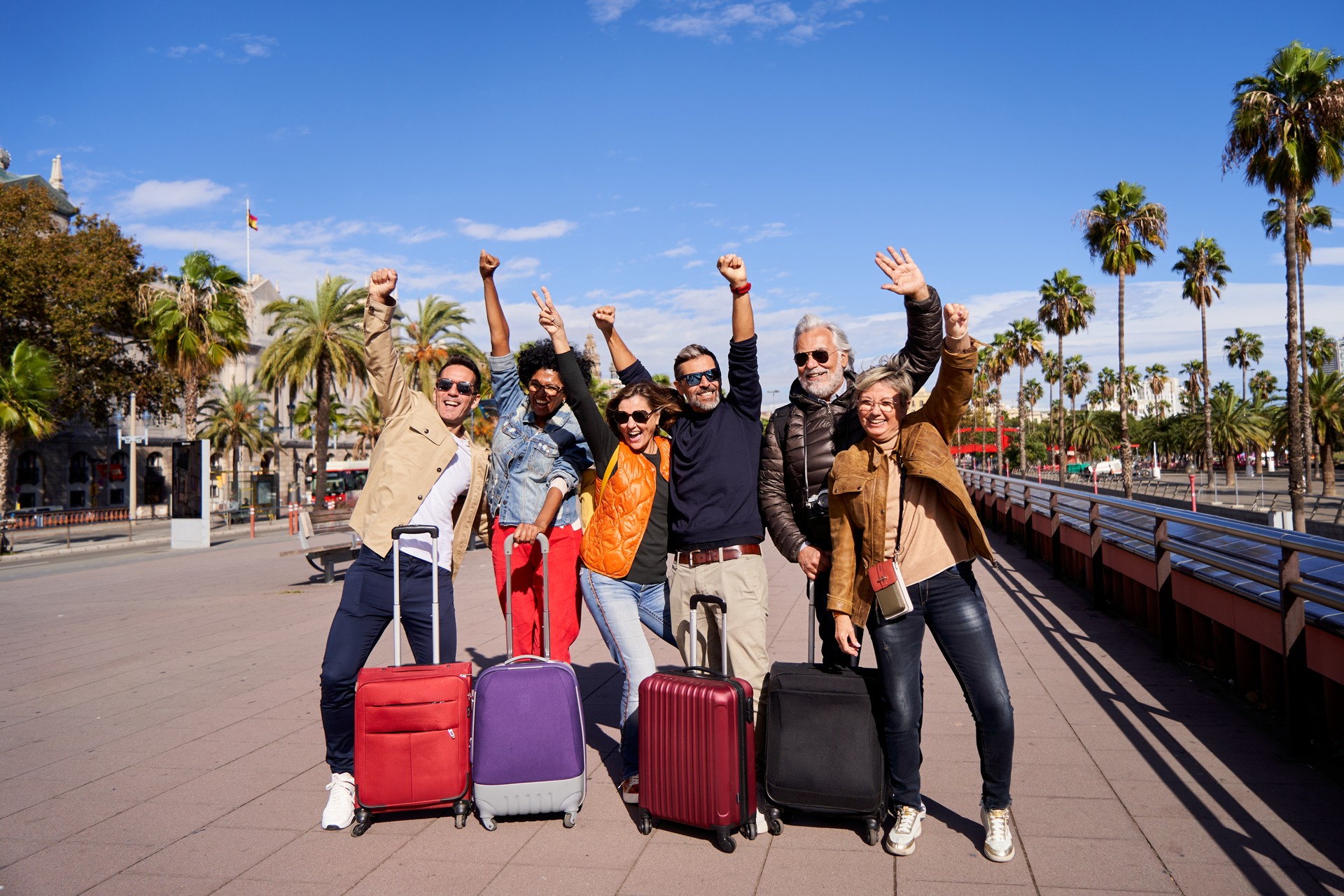 Group of middle aged friends posing for the camera happily celebrating their holidays.